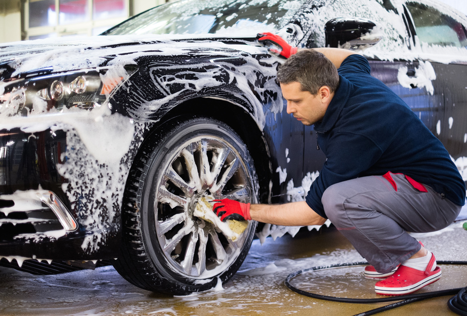 Worker Washing Car